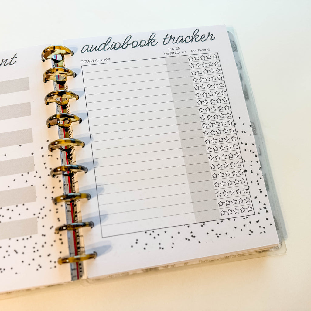 Audiobook tracker page in a planner with star ratings.